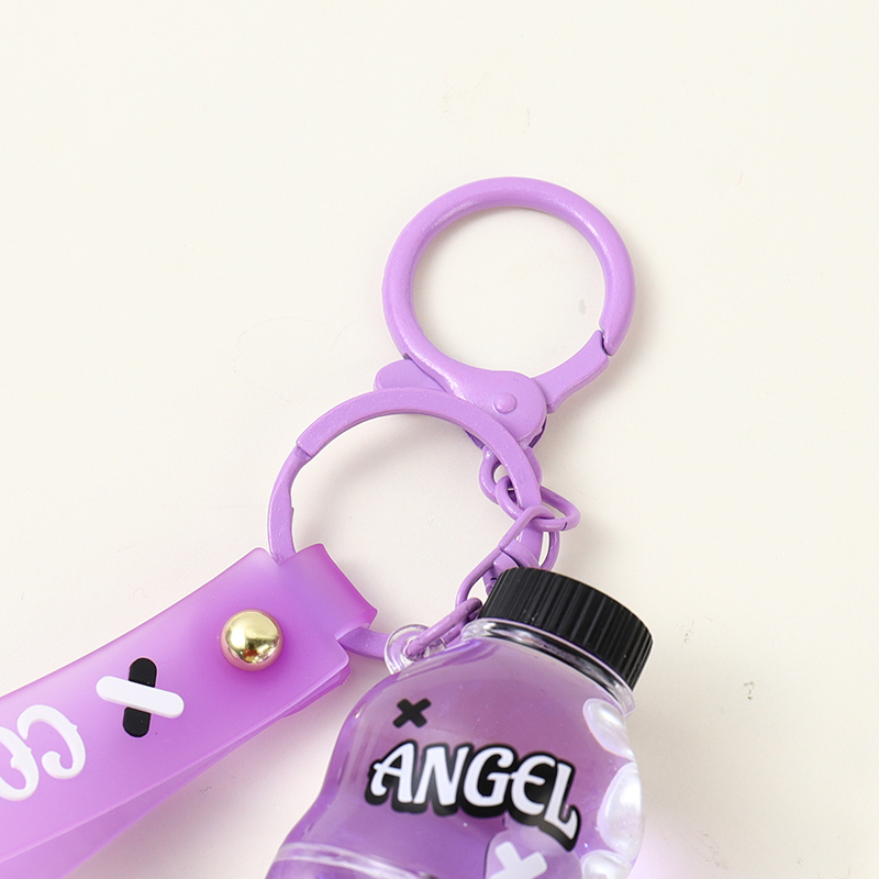 سلسلة مفاتيح عائمة من زيت زجاجة كوكا كولا من ريبيل سويت هارت