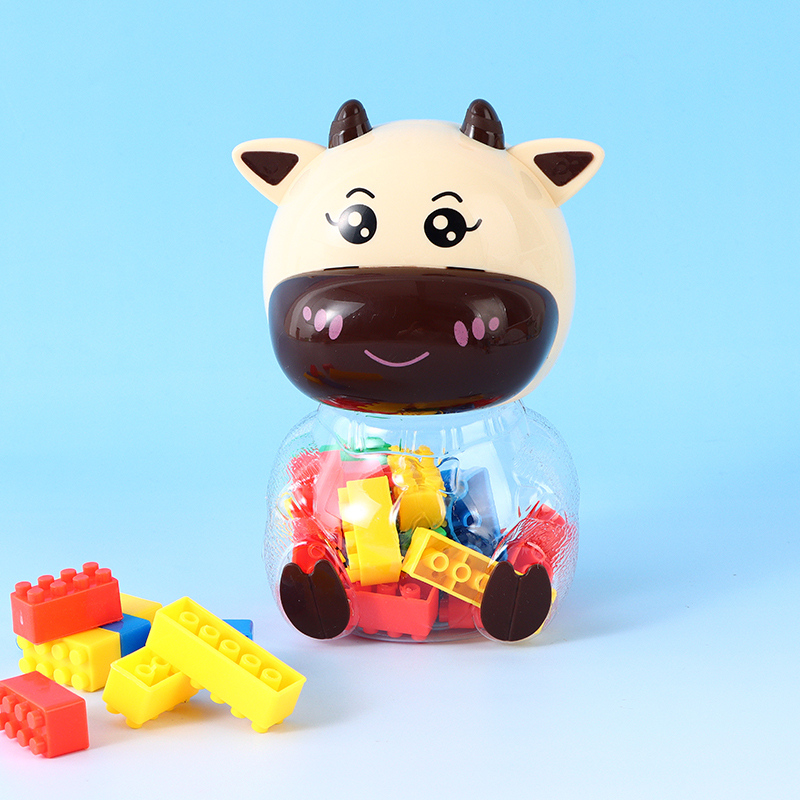 Building Blocks with Cute Beige Cow Shaped Container