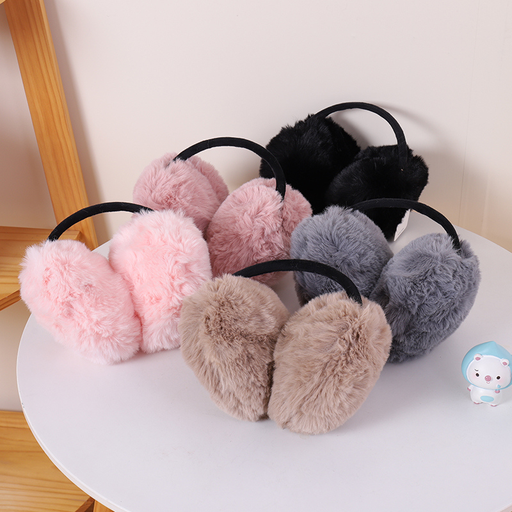 Women's ear muffs with large fur balls on the back